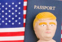 A humorous figurine resembling a political figure next to a passport on an American flag background