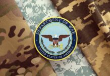 Department of War emblem on camouflage fabric