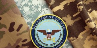 Department of War emblem on camouflage fabric