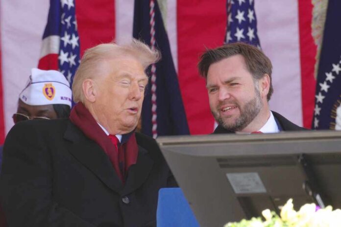 Donald Trump speaking at an outdoor event with a companion