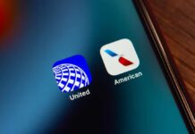 Close-up of United and American Airlines app icons on a smartphone screen
