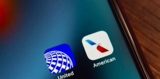 Close-up of United and American Airlines app icons on a smartphone screen