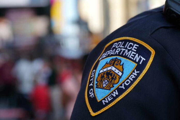Close-up of a New York City police badge on a uniform