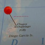A map showing the Chagos Archipelago with a red pin marking the location