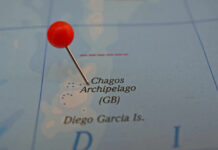 A map showing the Chagos Archipelago with a red pin marking the location