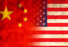 Trump-Xi Summit Reveals Tough Truths Flags of China and the USA blended together with a textured background