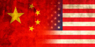 Trump-Xi Summit Reveals Tough Truths Flags of China and the USA blended together with a textured background