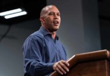Shocking Rhetoric: Dem Leader Targets MAGA ‘Extremists’ A speaker delivering a presentation at a podium