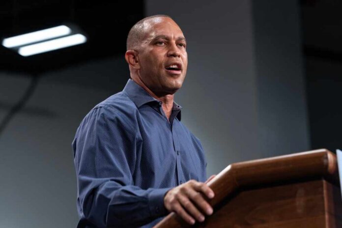 Representative,Hakeem,Jeffries,Speaks,During,Election,Campaign,Rally,For,Governor A speaker delivering a presentation at a podium