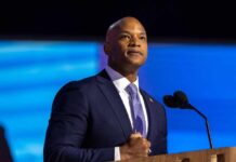 A confident speaker addressing an audience at a podium