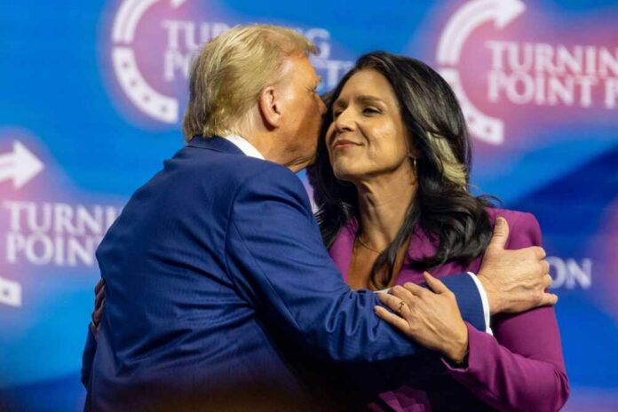 Two public figures embracing at a political conference