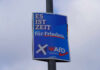 Political poster advocating for peace, featuring the AfD party logo