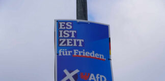 Far-Right Party’s Unstoppable Rise Stuns Germany Political poster advocating for peace, featuring the AfD party logo