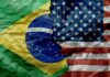Brazil and United States flags split by a jagged tear