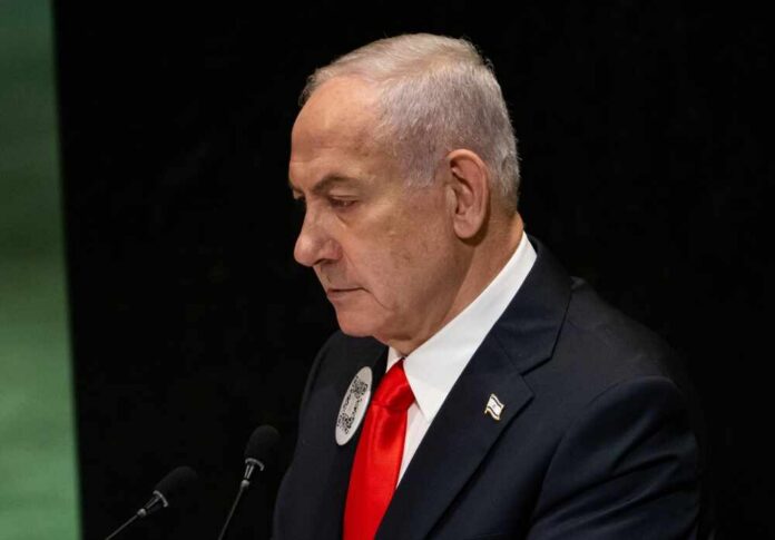 A political leader speaking at the UN assembly with a serious expression