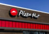 Pizza Hut storefront sign on a building exterior