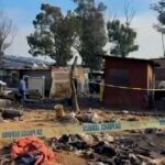 Bodies removed in Johannesburg after a dozen people killed by attackers in late-night mass shooting