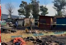Bodies removed in Johannesburg after a dozen people killed by attackers in late-night mass shooting