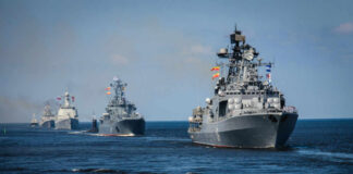 Deal Or Decoy? Hormuz Gamble Looms A fleet of military ships sailing in the ocean