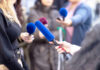 Media Circus Threatens Kirk Murder Trial Reporters holding microphones during an interview