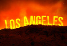 A dramatic landscape featuring the words Los Angeles against an orange sky, suggesting a fire or sunset.