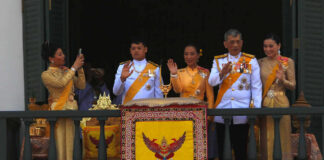 Royal Announcement Sparks Public Mourning Group on palace balcony in formal attire waving