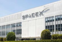 Senator Slams SpaceX Deal—SEC On Notice Exterior view of the SpaceX building with a prominent logo