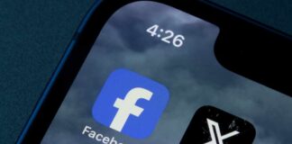 Close-up of smartphone screen displaying Facebook and X app icons
