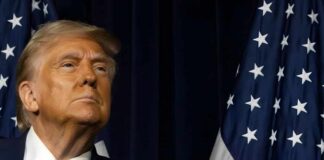 Mystery Strike: Did Trump Nail The Kingpin? A political figure looking upward beside an American flag