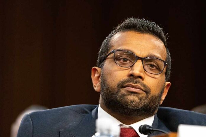 Individual in formal attire during a government hearing