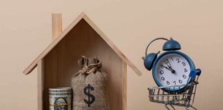 DeSantis Pushes Massive Tax Gambit A wooden house model with money and a clock in a shopping cart