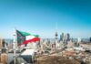 Missiles Over Kuwait—What Dragged America In? Kuwait flag waving over a city skyline with modern buildings