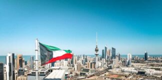 Missiles Over Kuwait—What Dragged America In? Kuwait flag waving over a city skyline with modern buildings