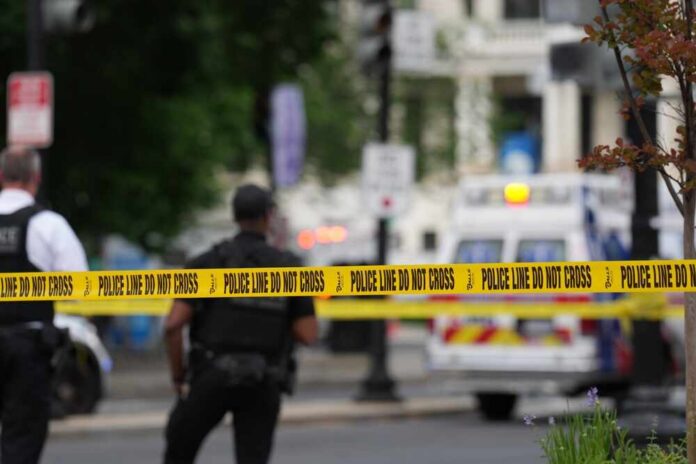 Washington,,Dc,,May,02,,2025:,A,Police,Officers,Investigates Police officers near a crime scene marked by caution tape