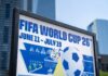 FIFA World Cup 26 poster with soccer ball in urban setting