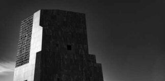 Obama Center Faces New Land Questions A modern architectural structure in black and white against a cloudy sky
