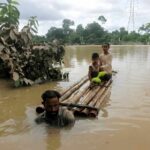 Bangladesh Flood Death Toll Climbs A crowded tent encampment near a border area with an American flag visible