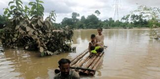 Bangladesh Flood Death Toll Climbs A crowded tent encampment near a border area with an American flag visible