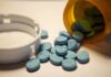 DOJ Crushes Telehealth Pill Mill A handgun, cash, and prescription pills scattered on a surface