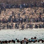 Could Spain Lose Schengen Access? Thousands of migrants swim around the border from Morocco into Ceuta, Spain