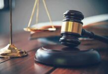 Trusted Dental Worker Betrays Young Patients Judge's gavel on block with scales of justice