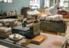 Italian Port Stops Giant Cocaine Haul industrial scale with white powder in a cluttered warehouse