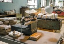 Italian Port Stops Giant Cocaine Haul industrial scale with white powder in a cluttered warehouse