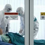 Senator’s Shocking Claim Rattles CDC Healthcare workers in hazmat suits treat a patient in a quarantine room