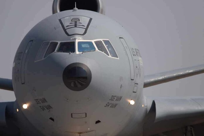 Front view of a large military cargo aircraft on the runway