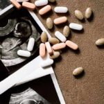 Ultrasound images with assorted pills on a brown surface