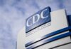 The Outbreak Few Expected To Return CDC headquarters sign against a cloudy sky