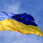 Britain Gives Ukraine A Powerful New Edge Ukrainian flag waving on a flagpole against blue sky
