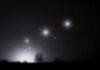Millions Left Dark Across Cuba Foggy night landscape with distant lights and silhouetted trees
