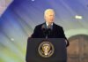 Biden Pardon Hits Wall In Congress man at presidential podium delivering a speech